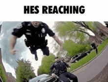 a couple of police officers are riding a motorcycle on a street .