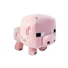 a stuffed pig with a minecraft logo on it 's head