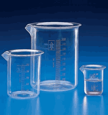 three clear plastic measuring cups with measurements on them are sitting on a blue surface