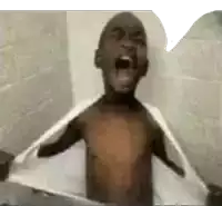 a shirtless young boy is taking a bath and screaming .