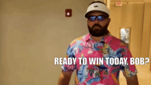 a man with a beard wearing sunglasses and a pink shirt says ready to win today bob