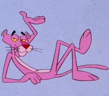 a pink panther is laying down and giving a thumbs up sign