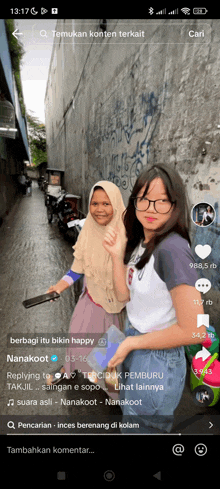 two girls are standing next to each other in a dark alleyway