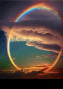 a circle of clouds with a rainbow in the center