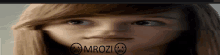 a close up of a girl 's face with the words mrozi written on it