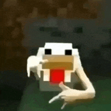 a pixelated chicken is giving a thumbs up in a minecraft video .