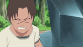 a boy in a white shirt is making a face