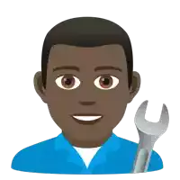 a man in a blue shirt holds a wrench