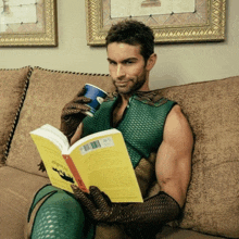 a man in a green outfit is reading a book