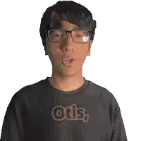 a man wearing glasses and a black shirt with the word otis on it