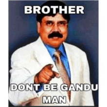 a man in a suit and tie is pointing at the camera with the caption brother dont be gundu man