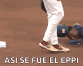a man is laying on the ground with the words " asi se fue el eppi " written below him