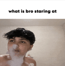 a man taking a bath with foam on his face and the caption what is bro staring at