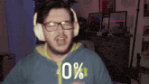 a man wearing headphones and a blue shirt has 0 % written on his shirt