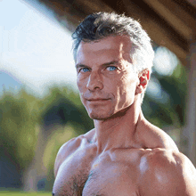 a shirtless man with gray hair and blue eyes