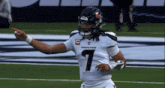 a football player with the number 1 on his jersey is pointing