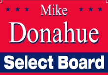 a red sign that says mike donahue select board in white letters