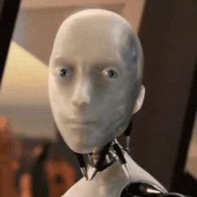 a close up of a robot 's head with a serious look on it 's face .