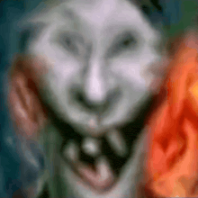 a blurry picture of a person 's face with their mouth open and a scarf around their neck