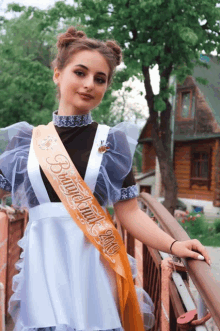 a girl wearing a sash that says 2019