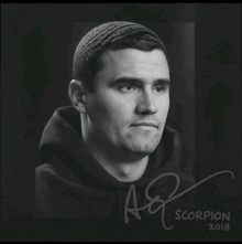 a black and white portrait of a man with the year 2018 on the bottom