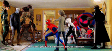 a group of spiderman characters are dancing in a living room while a woman says we don t pick the ballroom we just dance