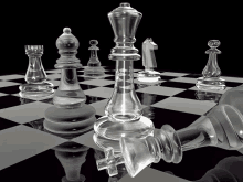 glass chess pieces on a black and white checkered board