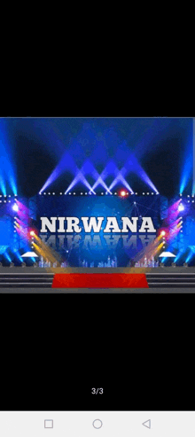 a stage with a red carpet and the word nirvana on it