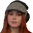 a woman is wearing a hat and headphones .