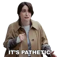 a woman in a trench coat says it 's pathetic while pointing