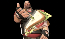 a man is holding a sandwich and giving a thumbs up sign