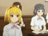 a group of anime girls are sitting at desks in a classroom