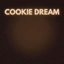 a cookie dream milkshake with whipped cream and oreo cookies