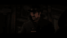 a man in a cowboy hat says " look at you " in a dark room