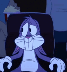 a cartoon of bugs bunny sitting in a chair with a sad look on his face