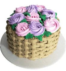 a cake in the shape of a basket with pink and purple frosting