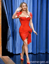 a woman in a red dress is walking on a stage with meme-gen.ai in the corner