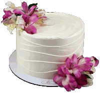 a white cake with pink and white flowers on top is on a plate that says lili