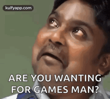 a man is making a funny face while looking up and saying `` are you wanting for games man ? ''