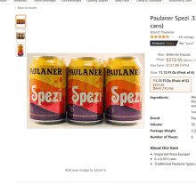 three cans of paulaner spezi are shown on a website