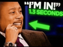 a man in a suit and tie is smiling in front of a sign that says i 'm in 1.3 seconds