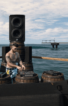 a man playing music in front of a stack of speakers that say jbl on them