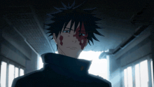 a man with blood on his face is standing in a dark room
