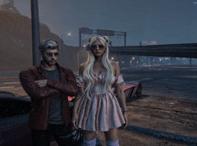 a man and a woman are standing in front of a highway with a sign that says ' freeway ' above them