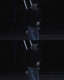 a man is riding a skateboard down stairs in a dark room