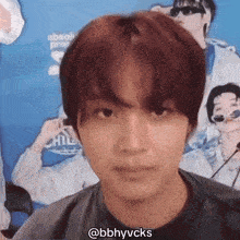 a close up of a young man 's face with the hashtag @bbhyvcks