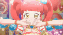 a girl with red hair and yellow eyes covering her mouth with her hands