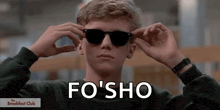 a man wearing sunglasses with the words fo ' sho written on the bottom