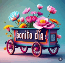 a wagon filled with flowers with the words bonito dia on it