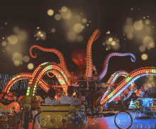 an octopus ride at an amusement park with bubbles coming out of it